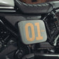 Black rectangular Honda CL250 CL500 Number Plate Side Cover with '01' printed on it, featuring a bunker logo, Glossy Metalic Grey Finish