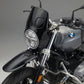 Close-up of a bmw r ninet headlight with a dark background custom Front fairing and front fender