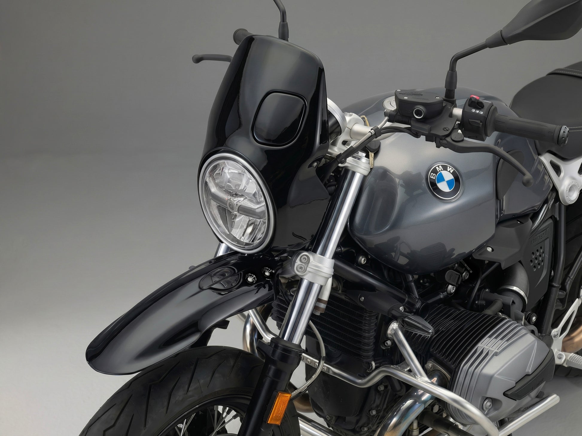 Close-up of a bmw r ninet headlight with a dark background custom Front fairing and front fender