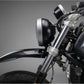 Close-up of a bmw r ninet headlight with a dark background custom front fender kit