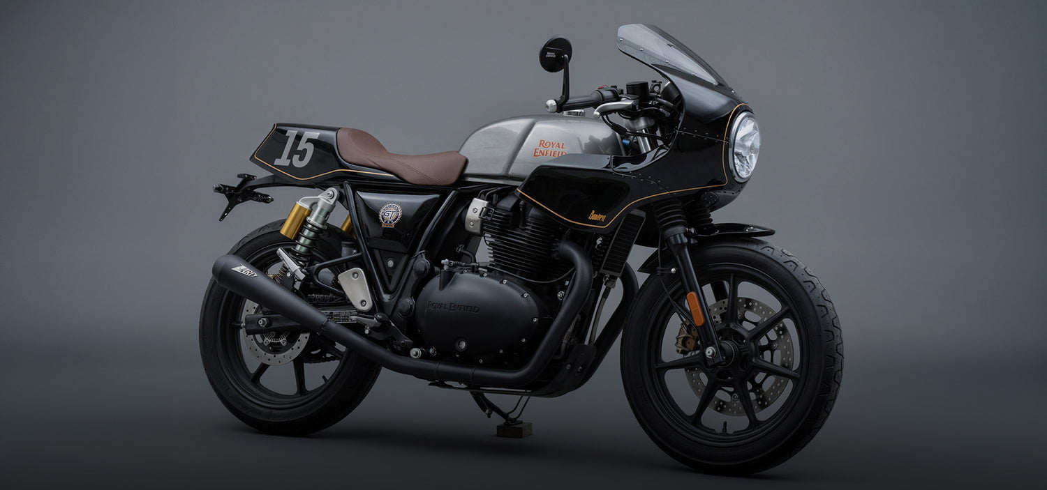Black Royal Enfield GT 650 Cafe racer motorcycle on a gray background Custom Front Fairing an Mono Seat Racer Seat Header image