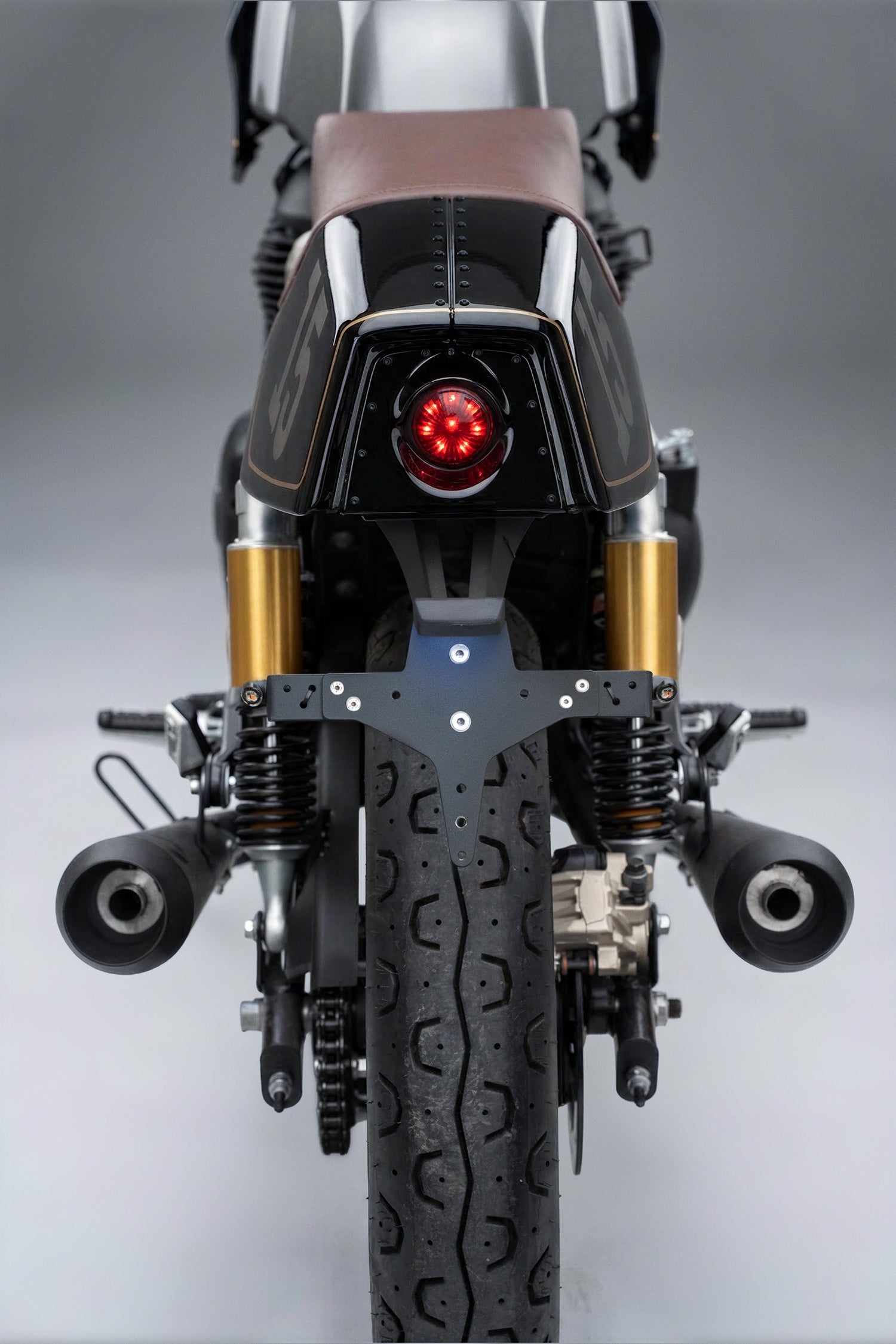 Black Royal Enfield with gold accents  Mono Seat tail tidy